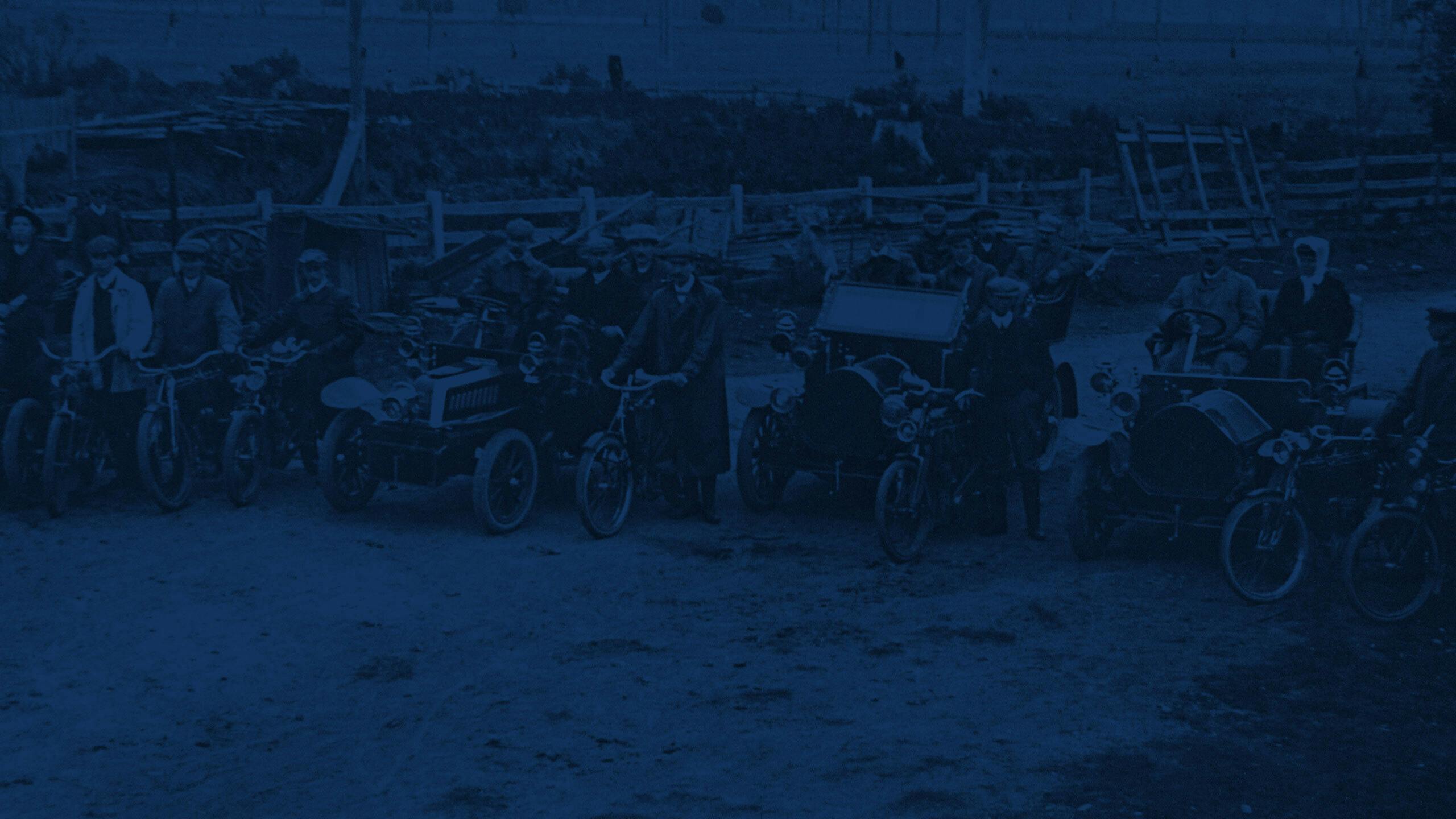 Vintage image with cars and motorbikes lined up