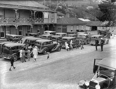 Vintage image of vehicles lined up.